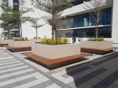 a row of benches in front of a building at Cosy 1 Bedroom in Damac Hills | OFEX in Dubai