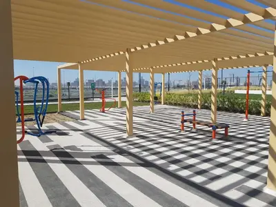 a pavilion with a playground with a blue playground at Cosy 1 Bedroom in Damac Hills | OFEX in Dubai