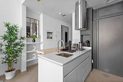 a kitchen with a sink and a counter top at StoneTree - Brand new Studio in Mohammed Bin Rashid City in Dubai