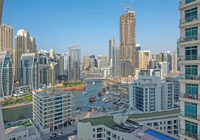 a view of a city with a river and buildings at HAVN - 2 Bedroom Apartment with Dubai Marina View in Dubai