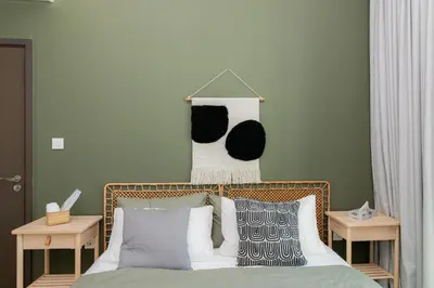 a bedroom with a bed with black and white pillows at Elite Escape Holiday Home - 2 BHK Getaway with Burj Khalifa View and Dubai Mall Access - 1507 in Dubai