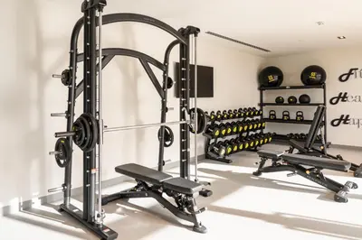 a gym with two treadmills and a treadmill at Prime Retreats @ Burj Crown by Emaar, Downtown dubai in Dubai