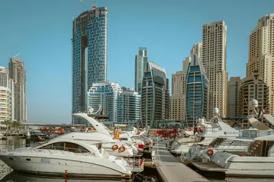 a group of boats docked in a harbor in a city at Private Studio Burj Khalifa Area -BEST PRICE in Dubai