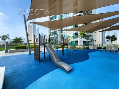 a playground on the roof of a building with a slide at Downtown Views II by Emaar, Downtown Dubai in Dubai