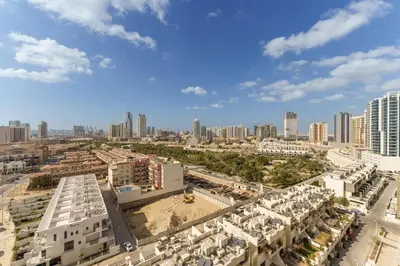 an aerial view of a city with tall buildings at Luxury Living in 1 bedroom apartment in JVC in Dubai
