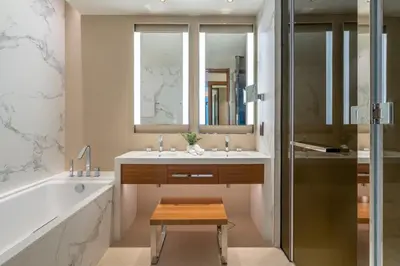 a bathroom with a tub and a sink and a shower at GuestReady - Contemporary delight in Dubai in Dubai