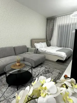 a living room with a couch and a bed at Dubai Marina - Huge Luxury Studio Apartment in Dubai