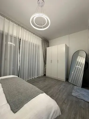 a bedroom with a large bed and a mirror at Dubai Marina - Huge Luxury Studio Apartment in Dubai
