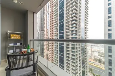 a balcony with a view of a large building at Frank Porter - Torch Tower in Dubai