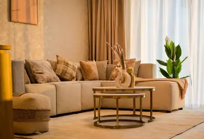 a living room with a couch and a table at Burj Khalifa view Lux 3 bedroom by Tanami Holiday Homes in Dubai