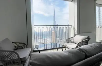 a living room with a couch and a balcony at Burj Khalifa view Lux 3 bedroom by Tanami Holiday Homes in Dubai