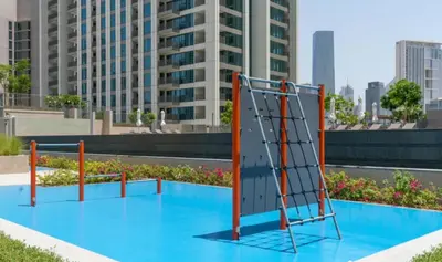 a playground with a slide on top of a building at Burj Khalifa view Lux 3 bedroom by Tanami Holiday Homes in Dubai