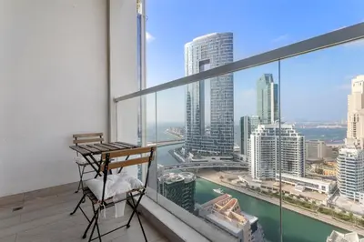 a balcony with a desk and a view of the city at Summer offer! All Inclusive! Prime Location in Dubai