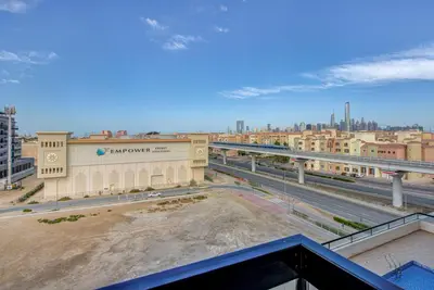 a view from the balcony of a building in a city at Mira Holiday Homes -Newly 2 bedroom close to metro. in Dubai