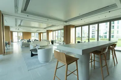 a large lobby with a large table and chairs at Stunning 2 Bedroom Apartment with Burj Views by Zen Stays - Walking Distance to Dubai Mall in Dubai