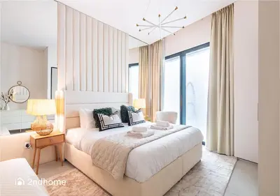 a bedroom with a large bed and a large window at 2ndHome - Address Beach Resort, Tower 1, JBR in Dubai