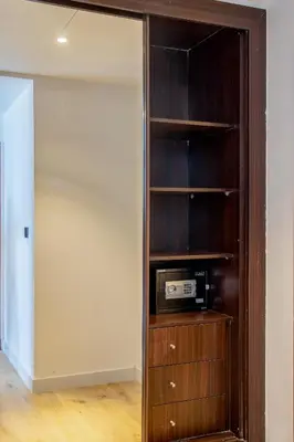 a room with a closet with a microwave in it at Deluxe - Sea view - Dubai Marina in Dubai
