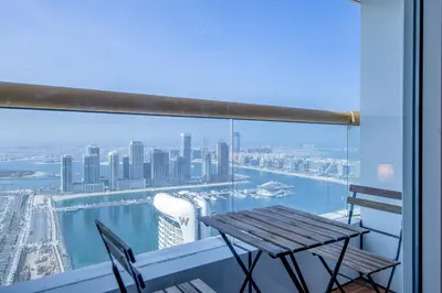 a table and chairs on a balcony with a view of the city at Deluxe - Sea view - Dubai Marina in Dubai