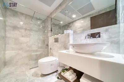 a bathroom with a sink and a toilet at Luxurious Two-Bedroom Apartment in Dubai