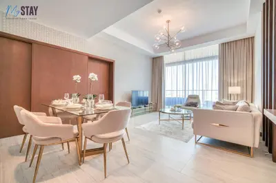 a dining room with a table and chairs at Luxurious Two-Bedroom Apartment in Dubai