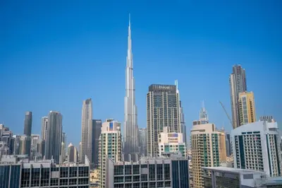 a view of a city skyline with skyscrapers at The Dreamer 1BR Burj Khalifa View Business Bay in Dubai