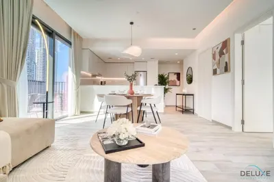 a living room with a couch and a table at Welcoming 1BR Apartment in Ahad Residences Business Bay by Deluxe Holiday Homes in Dubai