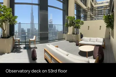 a room with a balcony with a couch and a table at *Views of Burj Khalifa Fountain* in Dubai
