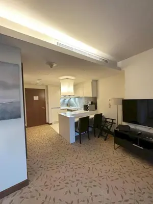 a large room with a kitchen and a living room at Suitestay-Formerly Address Dubai Mall Residence-Downtown in Dubai