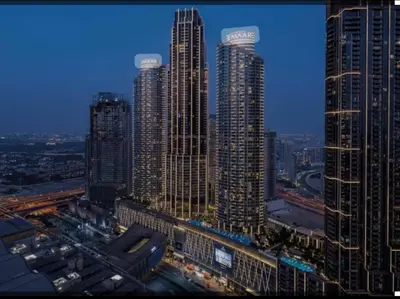 a group of tall buildings in a city at night at Emaar Residence Fashion Avenue - formerly Address Dubai Mall in Dubai