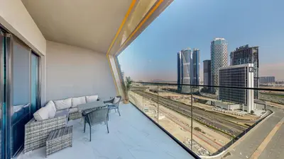 a balcony with a view of a city skyline at Serene City Stays Binghatti Canal Luxe 2BR in Dubai