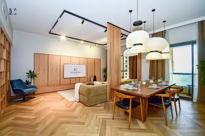 a dining room with a table and a couch at Luxury Escapes - Charming 3BR plus maids Apt near JBR Beach - Sadaf 1 in Dubai
