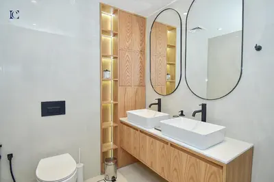 a bathroom with two sinks and a mirror at Luxury Escapes - Charming 3BR plus maids Apt near JBR Beach - Sadaf 1 in Dubai