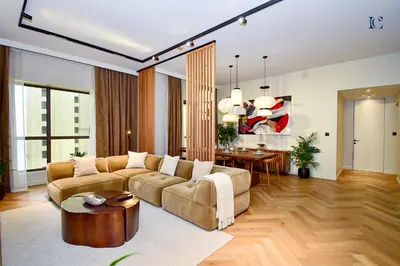 a living room with a couch and a table at Luxury Escapes - Charming 3BR plus maids Apt near JBR Beach - Sadaf 1 in Dubai