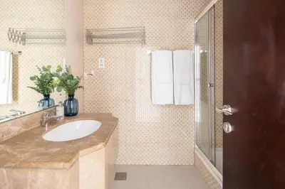 a bathroom with a sink and a shower at Frank Porter - Al Waleed Paradise in Dubai
