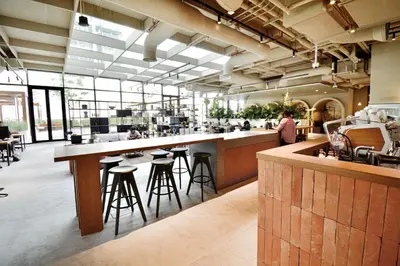 a restaurant with a bar with stools at Studio with Burj Khalifa View - Upside Living in Dubai