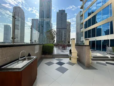 a balcony with a sink and a view of a city at StoneTree - Cozy Studio - JLT in Dubai