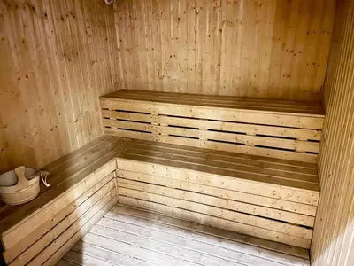 a wooden sauna with a wooden floor and a wooden at StoneTree - Cozy Studio - JLT in Dubai