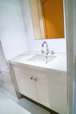 a bathroom with a white sink and a mirror at Magnificent 3BR with Incredible Burj & Fountain View in Dubai