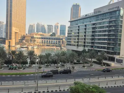a city with cars parked in a parking lot at Bahar - Luxury 1BR - Near JBR Beach - Prime Location - JBR in Dubai