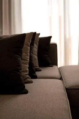 a row of pillows sitting on top of a couch at Dubaistay Luxury 2 Bedroom holiday appartment JVC KING and QUEENSIZE in Dubai