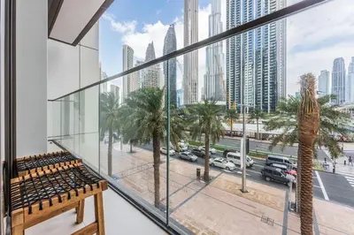 a balcony with a view of a city at Stayis l 2BR Iconic Burj Khalifa View Partial in Dubai