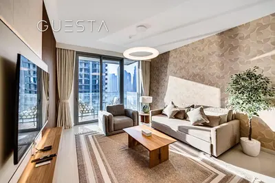 a living room with a couch and a table at Emaar Beachfront - Beach Isle Tower 2, Dubai Marina in Dubai