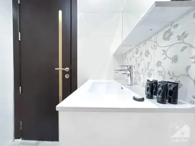a bathroom with a sink and a faucet at Stunning studio with Balcony in Arjan in Dubai