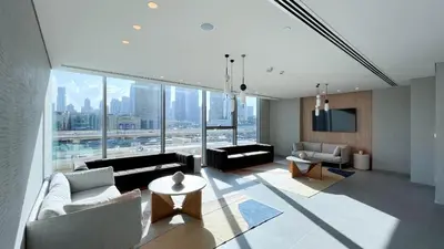 a living room with a view of a city at Burj Khalifa View, High Floor, Dubai Mall Access, Gym, Infinity-Pool, Playground, BBQ, Family Friendly in Dubai
