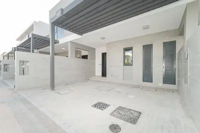 an empty room of a building with a brick wall at Luxurious 3 BR with Maid Room in Arabian Ranches 2 in Dubai