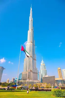 a view of the burj khalifa from a park at First Class Stay in Downtown Dubai Near Burj Park by SBH in Dubai