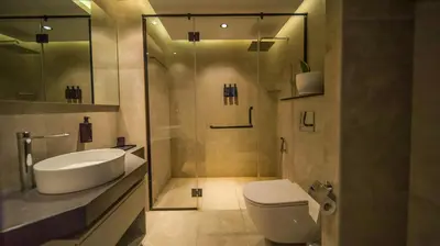 a bathroom with a sink and a toilet and a shower at Nas House Private & Shared Villas in Dubai