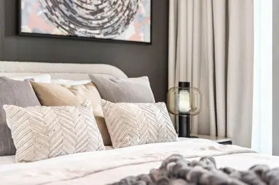 a bedroom with a white bed with pillows at The Smart Concierge - Downtown views 2 in Dubai