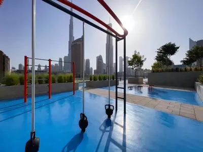 a swimming pool with a city skyline in the background at The Smart Concierge - Downtown views 2 in Dubai
