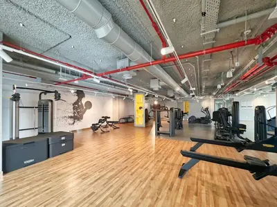 a gym with treadmills and exercise equipment in a room at The Smart Concierge - Downtown views 2 in Dubai